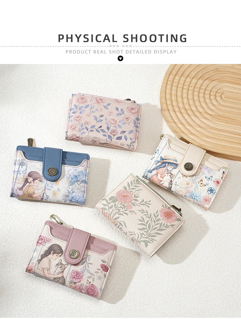 A display of various floral print women's wallets and card holders in pastel pink, blue, and cream colors.