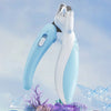 A light blue LED pet nail clipper with a safety guard is shown against a blurred background of ice and purple foliage.