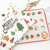 A colorful advent calendar featuring 24 days of Christmas themed charm bracelets and a gold-colored wooden tree.
