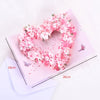 Pink floral heart wreath card with a couple silhouette and butterflies