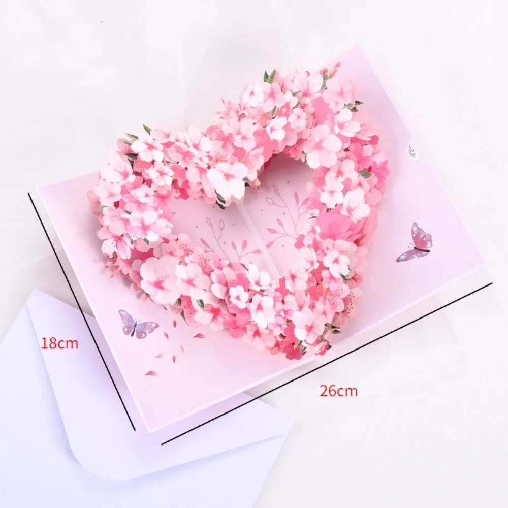 Pink floral heart wreath card with a couple silhouette and butterflies