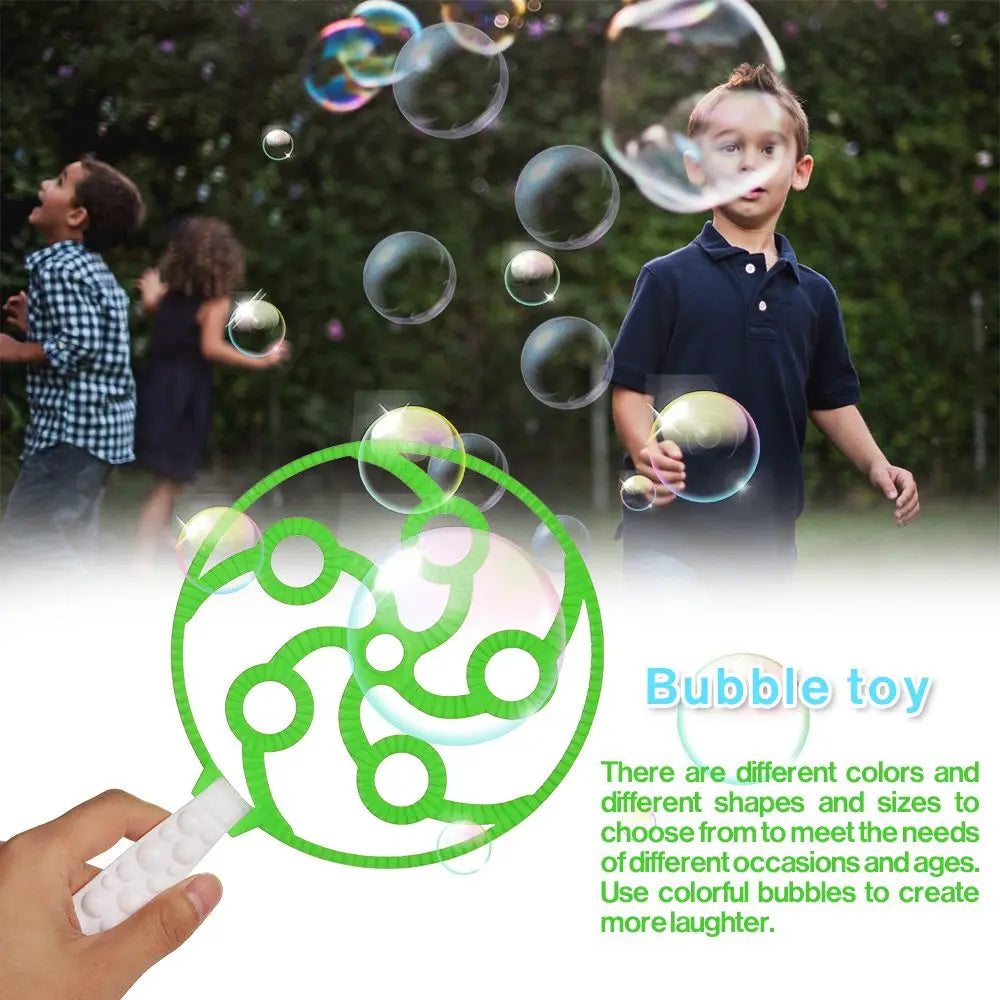 A child is blowing bubbles, with a green bubble wand toy visible in the foreground.
