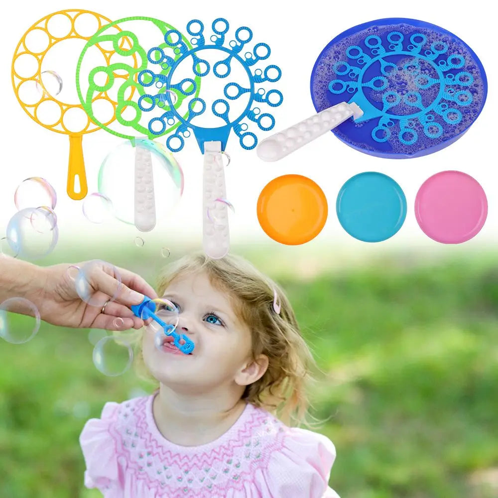 A child is blowing bubbles using a blue wand from a bubble party set outdoors, with various bubble tools and colors displayed