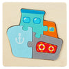 A wooden jigsaw puzzle featuring three interlocking puzzle pieces shaped like an anchor, a fish, and a geometric shape.