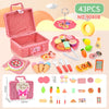 A pink wicker picnic basket set with various pretend play food items including fruits, pastries, and utensils for children