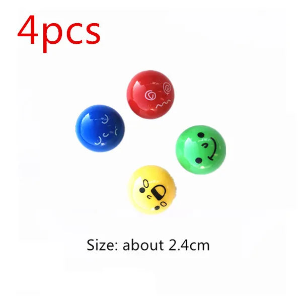 Four colorful glass marbles in red, blue, green, and yellow are shown for a marble run building blocks set.