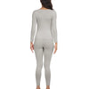 A woman is modeling a long-sleeved thermal top and matching leggings in a light gray color.