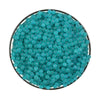 A circular display of small, teal-colored water beads.