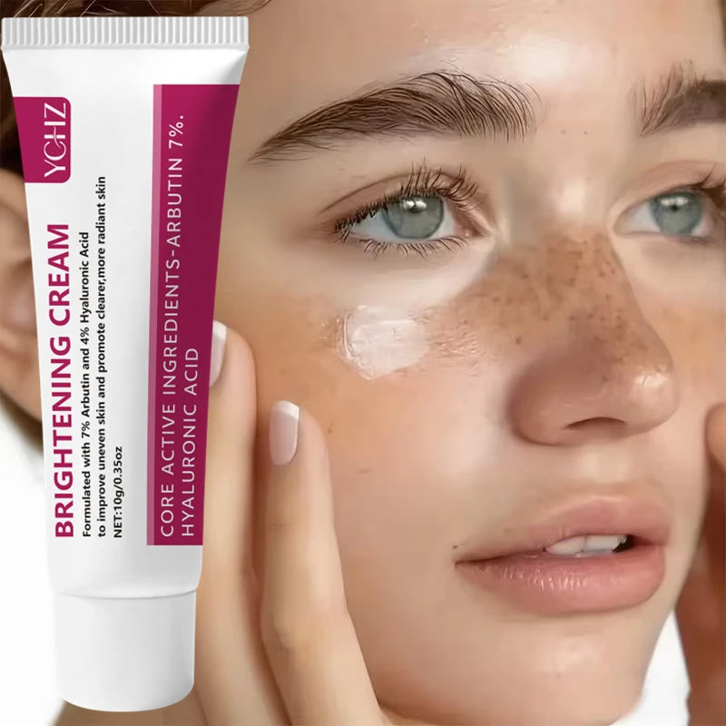 A close-up of a bottle of brightening cream being applied to a woman's face.