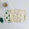 A set of five cream-colored baby cotton sleeveless jumpsuits with green and yellow leaf patterns.