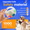 A hand holds an upgraded safe safety material squeaky dog ball toy with a convenient handle, next to several happy dogs.