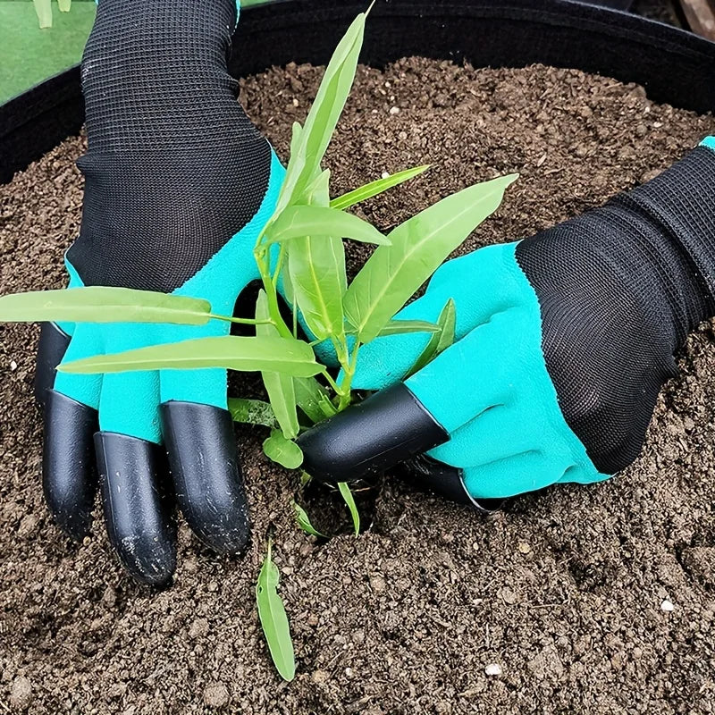 A pair of bright turquoise garden gloves with black claws are shown planting a green plant in dark soil.