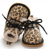 Pair of leopard print baby first walkers with soft rubber soles