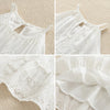 White cotton dress with lace detailing and suspender straps for a toddler girl
