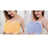 A woman holds a yellow silicone shower scraper with a textured brush head and a woman holds a blue silicone shower scraper.