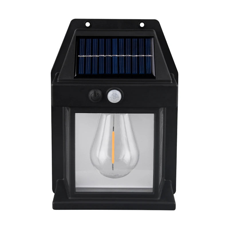A black solar-powered motion sensor wall light with a visible solar panel and an incandescent bulb inside.