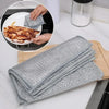 Stack of gray scratch-free microfiber cleaning cloths used for kitchen and home cleaning.