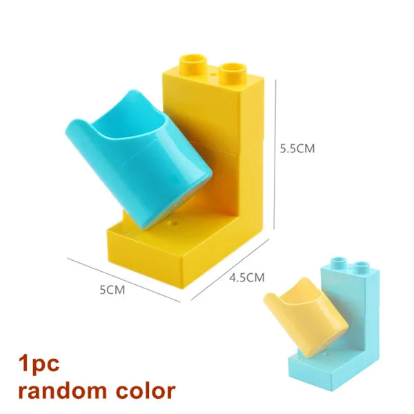 A yellow marble run building block set with a blue track piece and funnel component.