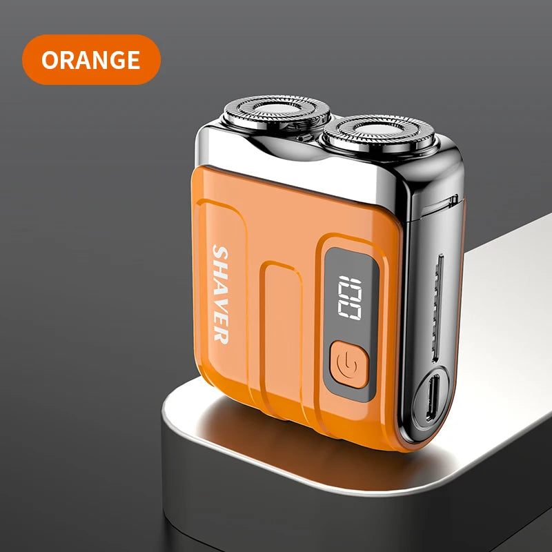 Afeminada naranja mini de afeitar eléctrica recargable por USB con pantalla digital, sobre superficie gris.