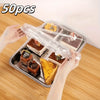 A hand is lifting a clear elastic food cover from a tray containing various baked goods and produce items.