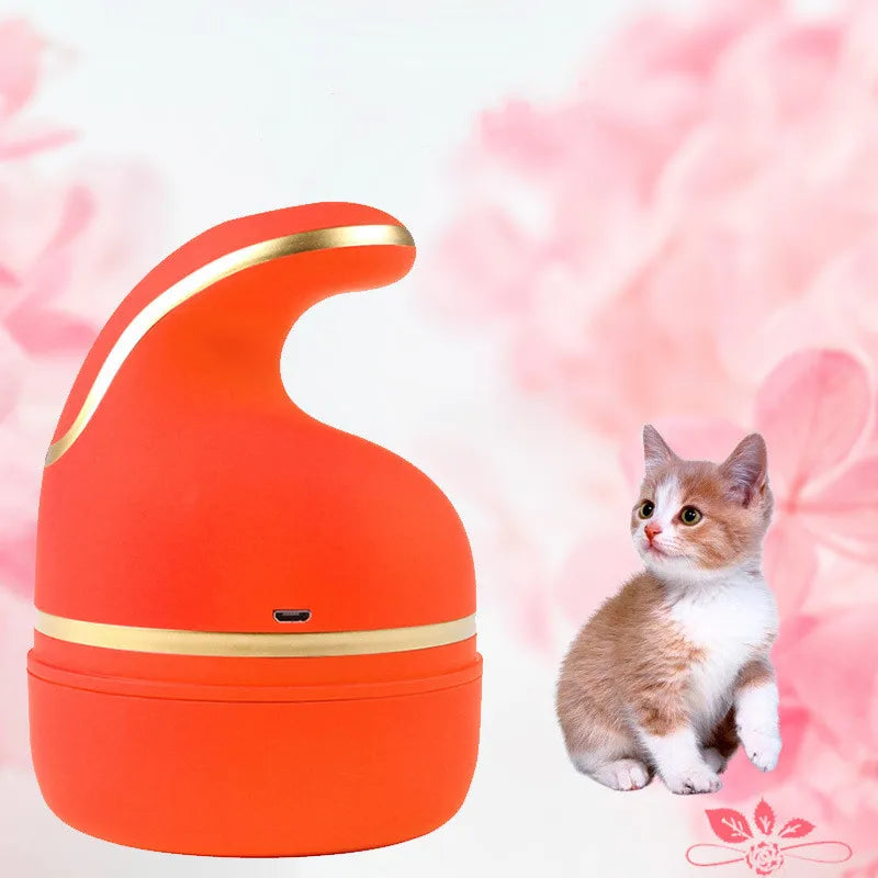 Masajeador eléctrico recargable para mascotas, color naranja, sobre fondo floral rosa.