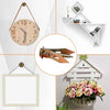 A kit of self-drilling drywall anchors and screws displayed alongside various decorative items.