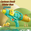 A green cartoon duck water gun toy is shown spraying water in a scene with mushrooms and trees.