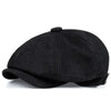 Black vintage retro newsboy cap with a rounded crown and a small top button