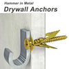 A close-up of a brass hammer in metal drywall anchors with screws being installed into a vertical panel.