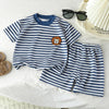 A navy blue and white striped short set for kids, featuring a collared tee and matching shorts.