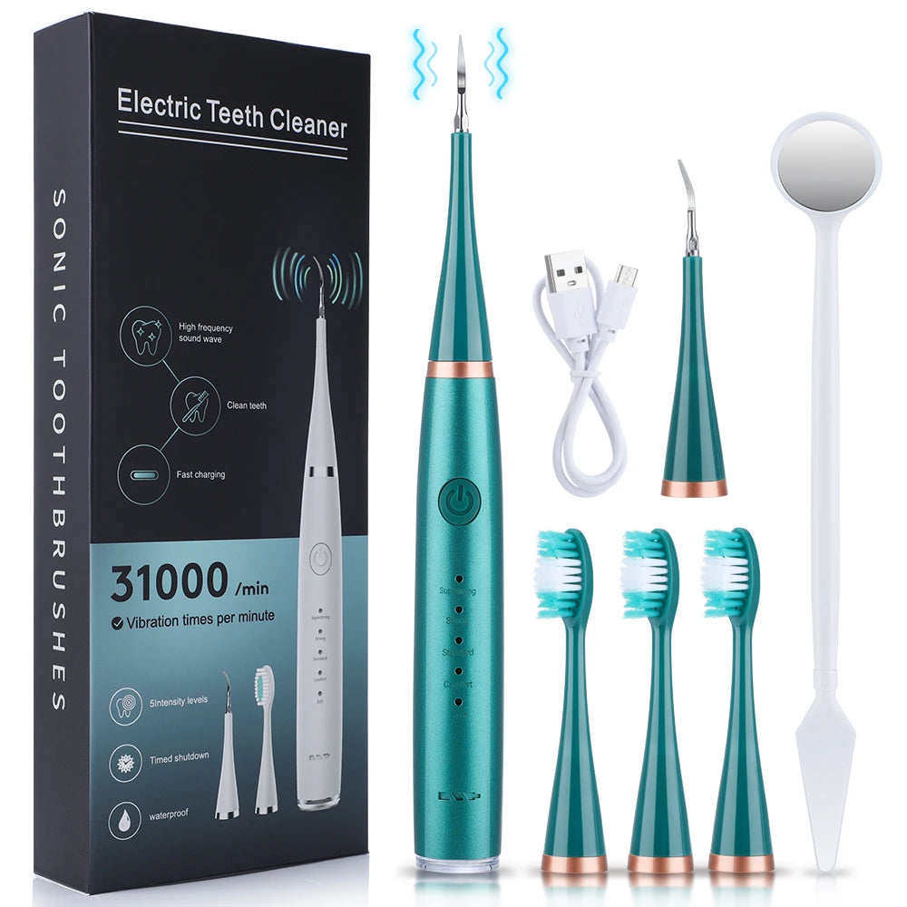 Un kit de cepillo de dientes sónico con caja, cepillo, raspador y cable de carga.