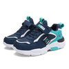 A pair of navy blue and teal kids' breathable running sneakers with hook-and-loop closure.