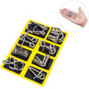 A yellow tray holds eight metal wire puzzle brain teasers for adults and teens.