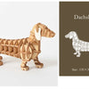 Kit de rompecabezas de madera para armar una figura de perro salchicha.