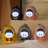 Four cute bear nightlight keychains in various colors including black, pink, and yellow, featuring an astronaut charm.