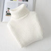 A white, ribbed knit turtleneck sweater for kids displayed on a light surface.