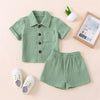 A light green textured cotton linen shirt and matching shorts set for a toddler.
