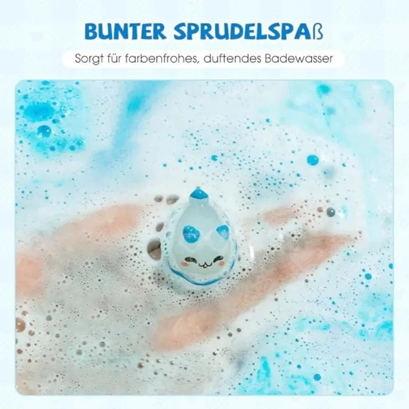 A hand is gently holding a small white cat-shaped bath fizzie in bubbly blue and white water.