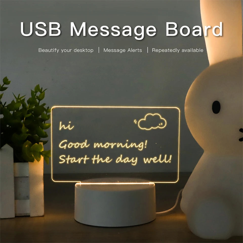 A glowing USB message board desk lamp shaped like a white rabbit displaying a morning greeting on a wooden surface.