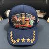 Navy baseball cap featuring a graphic of an eagle, a cross, and a statue of liberty with patriotic text.