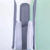 A pair of gray sock aids with white fabric strips for effortless sock application.