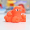 An orange rubber floating animal bath toy designed for toddlers.
