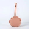 A pink silicone pacifier storage case with a loop lanyard attached to a cute, round animal-shaped component.