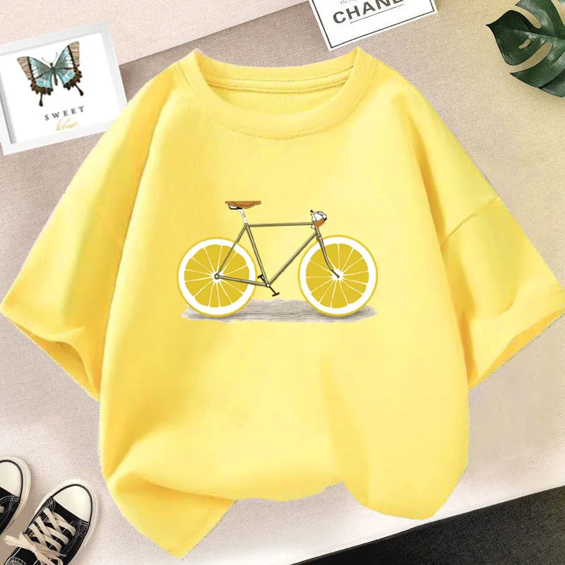 A yellow kids t-shirt featuring a graphic print of a bicycle with orange wheels.