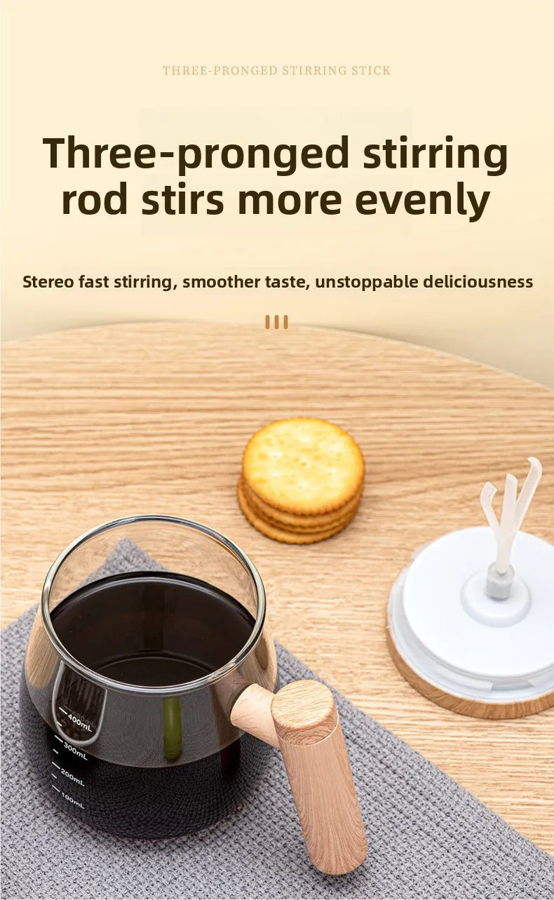 A three-pronged stirring rod is shown next to a mug and round crackers on a wooden table.