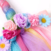 Colorful unicorn mesh headband featuring pink, purple, and blue flowers and glitter accents