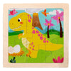 A wooden jigsaw puzzle featuring a yellow dinosaur surrounded by green grass and pink flowers.