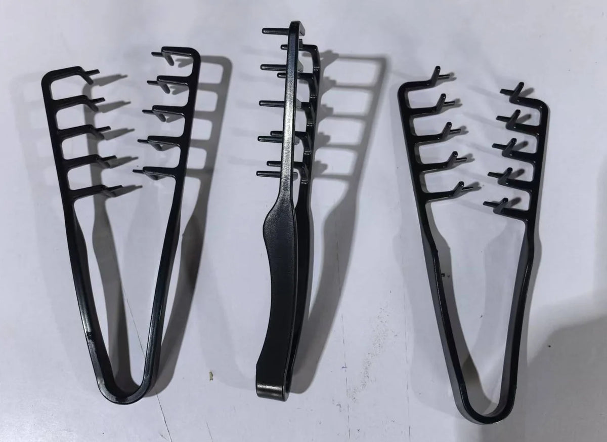 A set of black volumizing wide-tooth styling combs for men with a seam covering design.