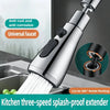 A silver kitchen faucet extender with a spray head shown in use for rinsing.