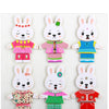Set of three wooden puzzle dress-up outfits featuring rabbits in various colors and patterns for children